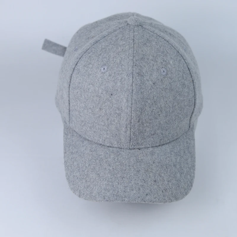 Front of the grey felt-look cap showing the undecorated crown and curved visor