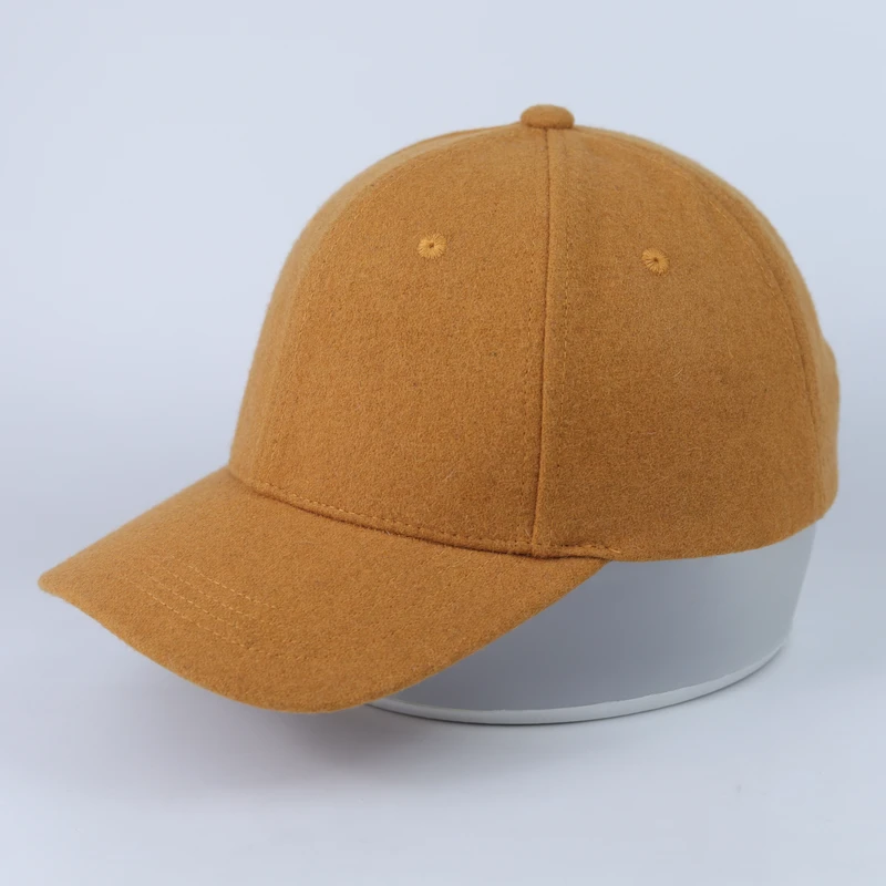 Side profile of the tan suede-look cap showing the crown shape and curved visor