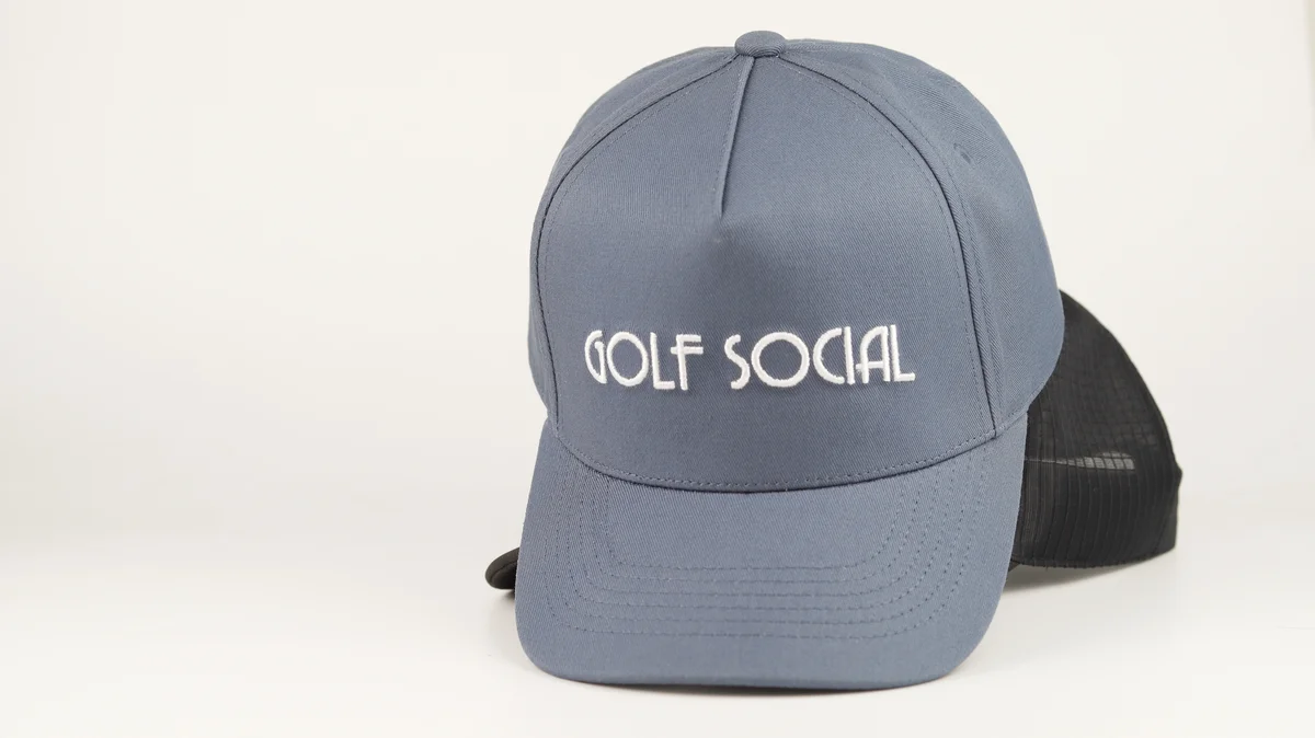 Front view of a grey cap with white embroidered lettering